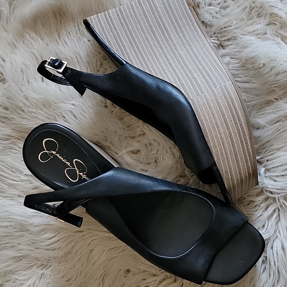 Black leather platform sandals.
